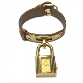 Montre HERMES Kelly pm en cuir crocodile orange et bijouterie dorée