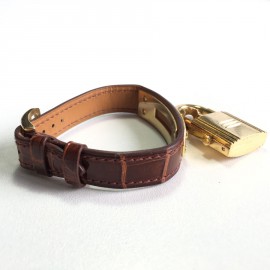 Montre Kelly HERMES bracelet en alligator marron et bijouterie plaqué or