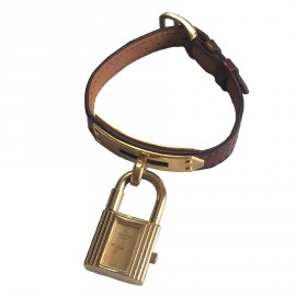 Montre Kelly HERMES bracelet en alligator marron et bijouterie plaqué or