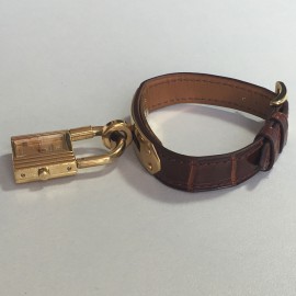 Montre Kelly HERMES bracelet en alligator marron et bijouterie plaqué or