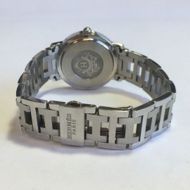 HERMES clipper watch with a blue mother of pearl background 