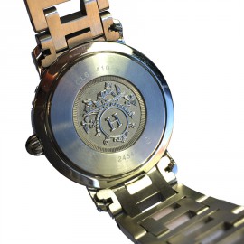 HERMES clipper watch with a blue mother of pearl background 