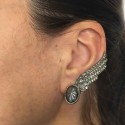 Boucle d'oreille clip  CHANEL Aile en métal argenté vieilli et strass