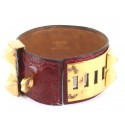 Manchette HERMES collier de chien en crocodile rouge foncé et or